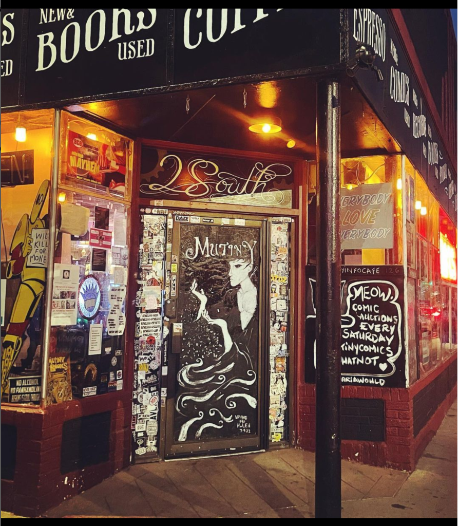 A store front with many signs on the wall.