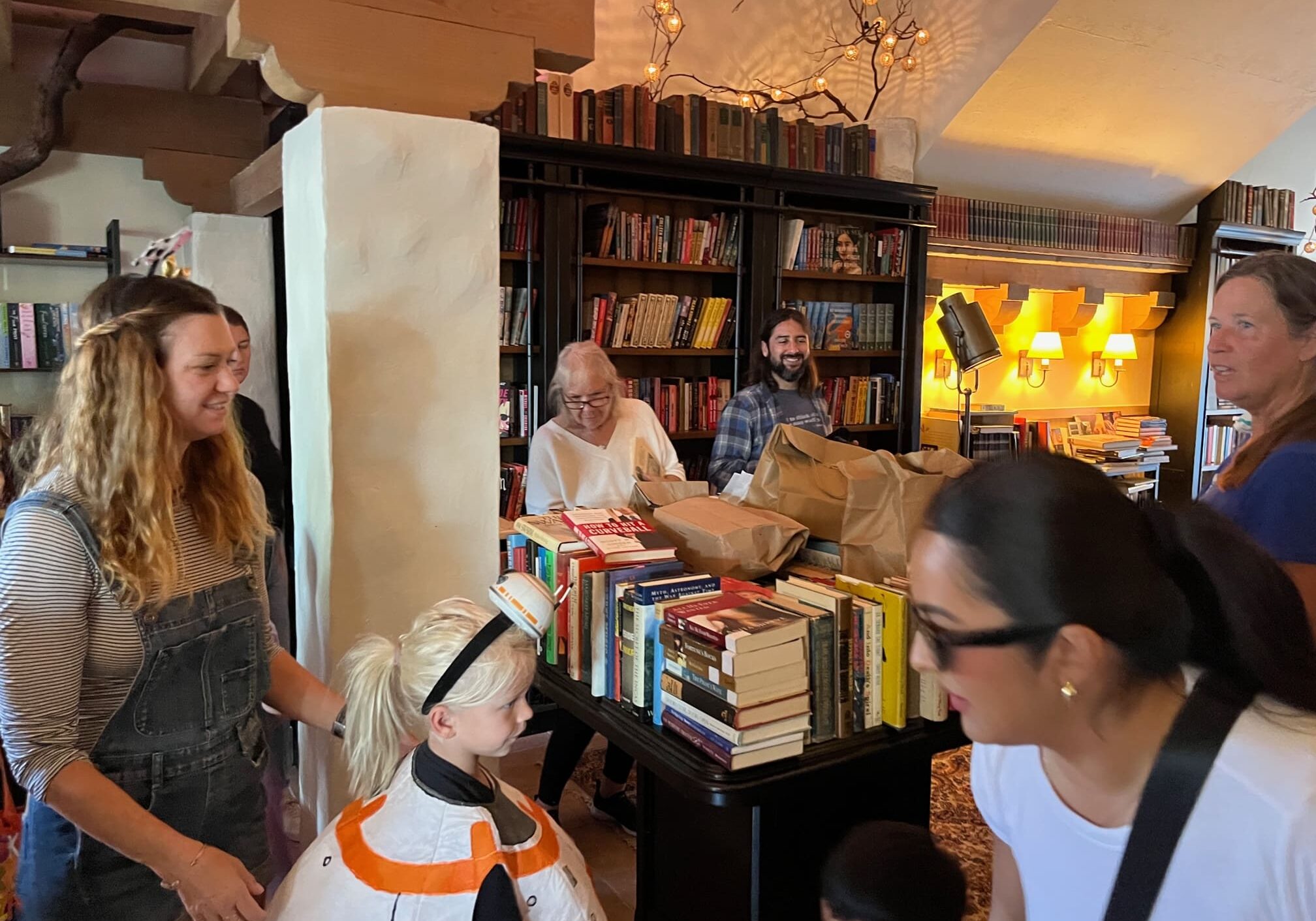 People gathering in cozy bookstore